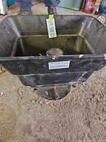 Overall view of Swisher plastic hopper broadcast spreader