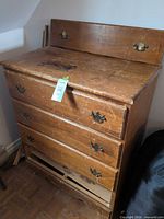 Front view showing full dresser, three drawers, backsplash