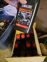 Close-up of a bottle showing Yamalube label, grade SAE 10W-40, 1 US qt