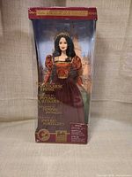 Front view of boxed Barbie showing doll, gown, crown and product title