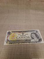 Obverse of the $1 banknote showing serial number, portrait and design