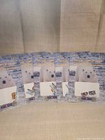 Five identical Canada Post polar bear stamp booklets arranged upright
