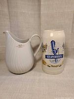 Pitcher and stein side by side showing overall design and scale