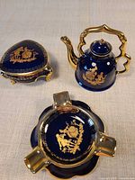 teapot, lidded trinket box and ashtray showing design, color and condition