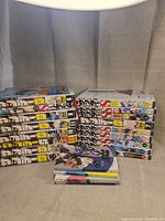 Two main stacks of manga plus four horizontal volumes