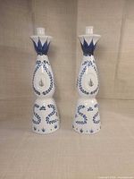 Full view of the pair of candlesticks showing design and height