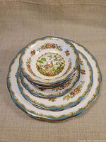 Stack of five Royal Albert bowls showing graduated sizes and pattern