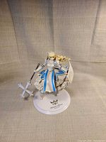 Full front view of Clalaclan Philias figure on base with weapon and shield