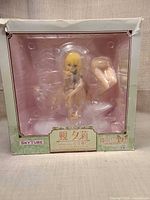 Front view of boxed Skytube figure in clear window showing figure and accessory