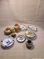 Group shot of all fourteen Portuguese ceramic items