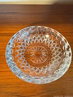 top view of clear cut glass serving bowl displaying diamond lattice and starburst patterns