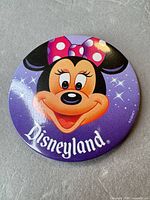 Front view of button showing Minnie Mouse graphic and Disneyland logo