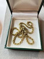 Necklace coiled in presentation box