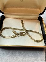 Bracelet in presentation box showing lobster clasp and Made in Korea tag