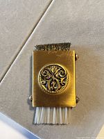 Full view of brush showing metal body, wire bristles top, nylon bristles bottom