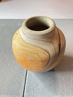 Front angled view of stoneware vase showing marbled finish and form