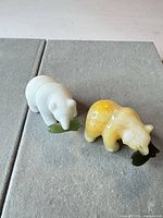 Both jade bear figurines side by side