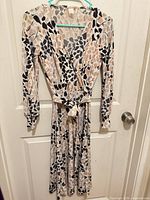 Front view of dress hanging on door