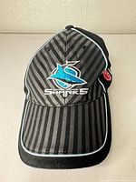 Front view showing Sharks logo, striping and piping on visor