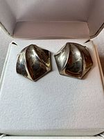 Front view of both stud earrings in box