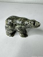 front and side view of soapstone bear figurine