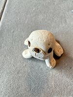 Front angled view of ceramic seal figurine