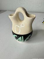 Front view showing crackle glaze and geometric band