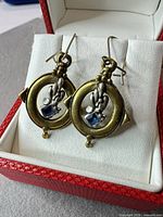 Earrings on display card in jewellery box