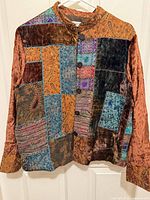 Front view of multicolor velvet patchwork jacket