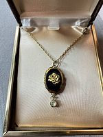 Necklace displayed in jewellery box showing full pendant and chain