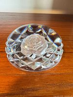 Top view showing overall shape, rose engraving, diamond-cut sides