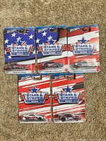 Front view of all five carded vehicles