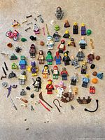 Overhead view of all minifigures, parts and accessories spread on surface