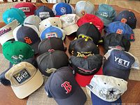 Top-down view of entire assortment of caps on table