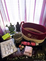Group shot showing all items including basket, heat gun, oil warmer, lantern, watering can, note pads, brush set pouch, wooden clips