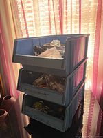 Stacked blue bins showing quantity of lot