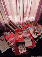 Group shot of all gift bags and wrapping paper rolls on table