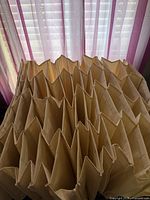 Accordion-style beige canvas compartments