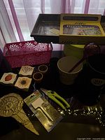 All items overview including Jiffy greenhouse, pink basket, seed kits, pots, labels, shears, metal stake