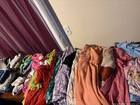 Overall view of folded girls clothing assortment on table