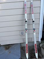 Full view of both K2 Sabre 77 skis leaning against wall