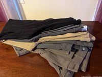 Stack of all five pants and leggings showing colors and fabrics