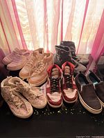 Six pairs of shoes displayed together on table