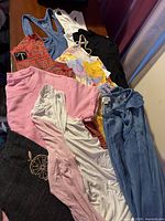 Nine assorted tops laid out showing variety