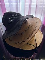 Stacked view of all three hats showing styles and colors