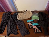 Overall view: tights, Yitty bodysuit, packaged knee-highs, No Nonsense control top