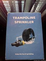Front of blue box labeled Trampoline Sprinkler with product image