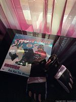 Snow tube box front with gloves placed on top