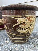 Full view of planter showing dragon relief on one side