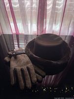 Gloves and hat together on table